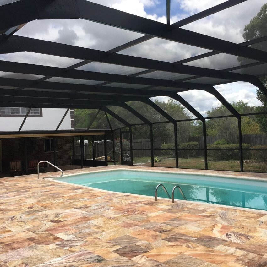 Pool Apollo an enclosed pool with a patio