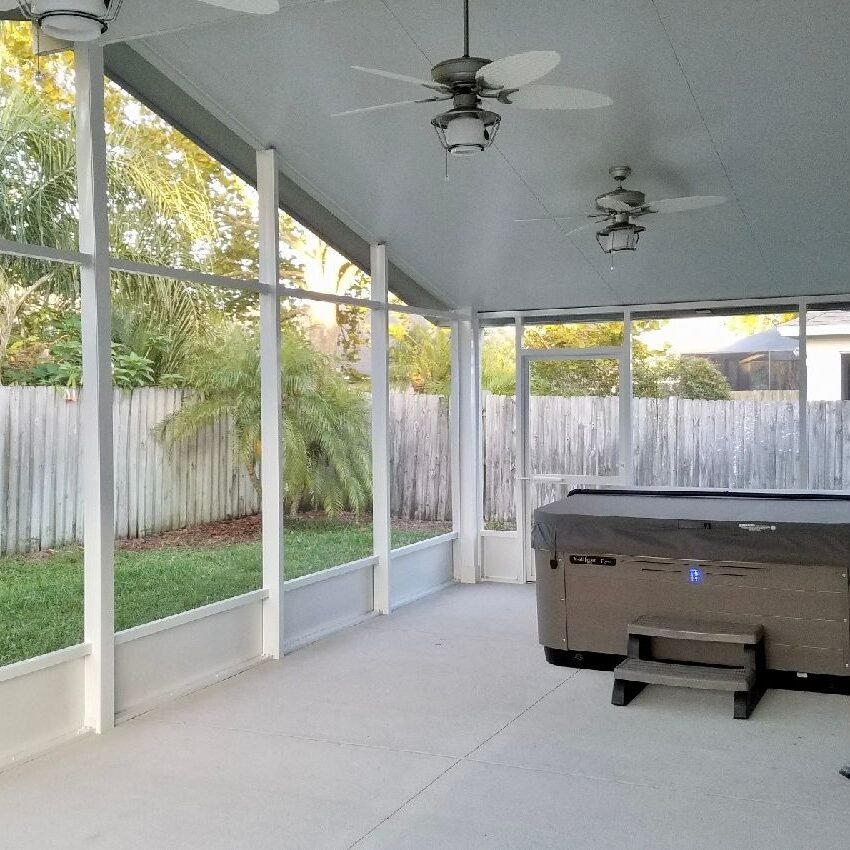 Sun Room Riverview an enclosed sunroom with a hot tub
